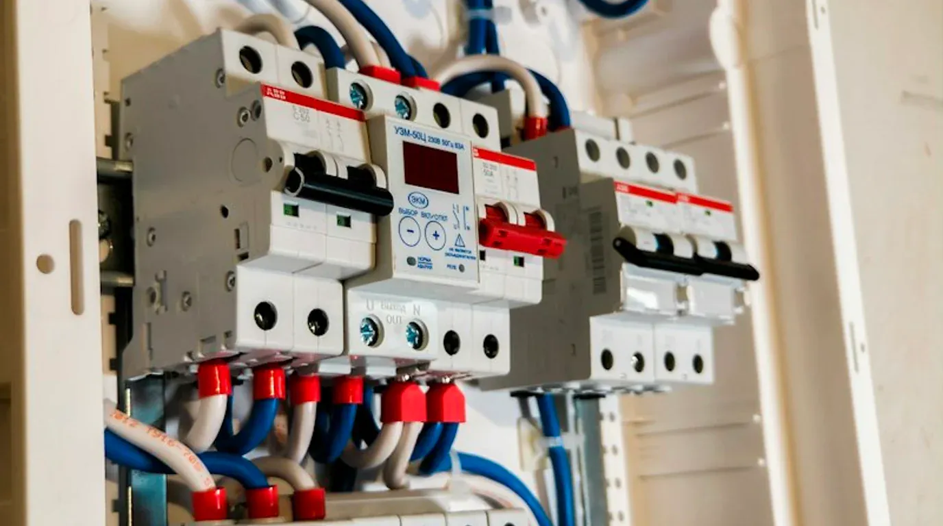 Circuit Breaker and Wiring Repair equipment - modern residential breakers with color-coded branch circuit wiring and distribution terminals