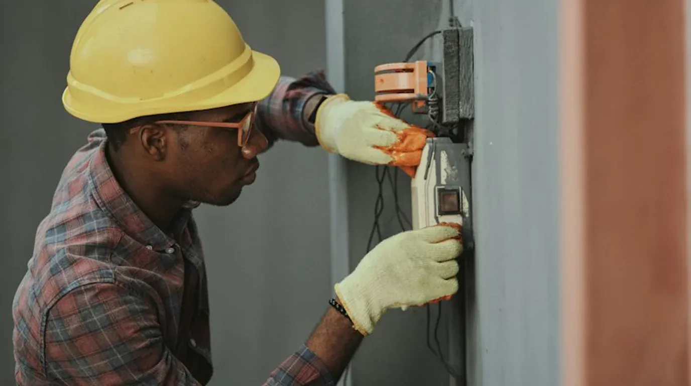 Electrical Repair diagnostic testing equipment - calibrated digital multimeter with test probes and residential junction box