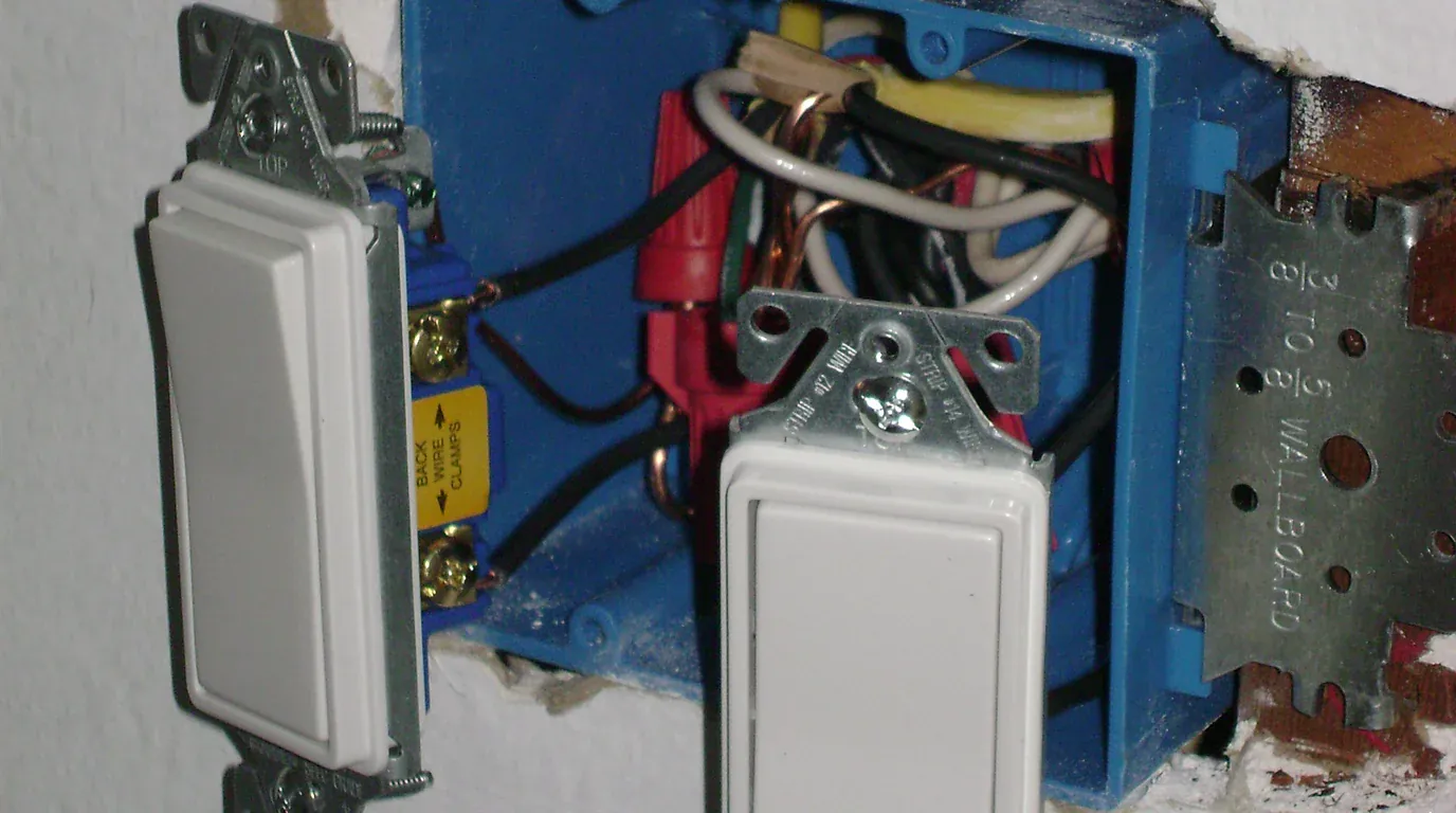 Outlet and Switch Repair hardware - residential dual-gang electrical wall box with Decora switches and wiring connectors